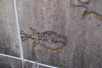 Wall carved with a picture of fish