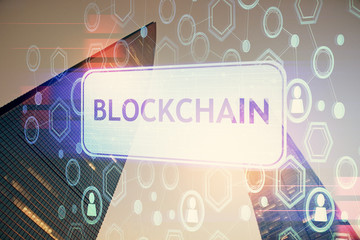 Multi exposure of cryptocurrency theme hologram drawing and city veiw background. Concept of...