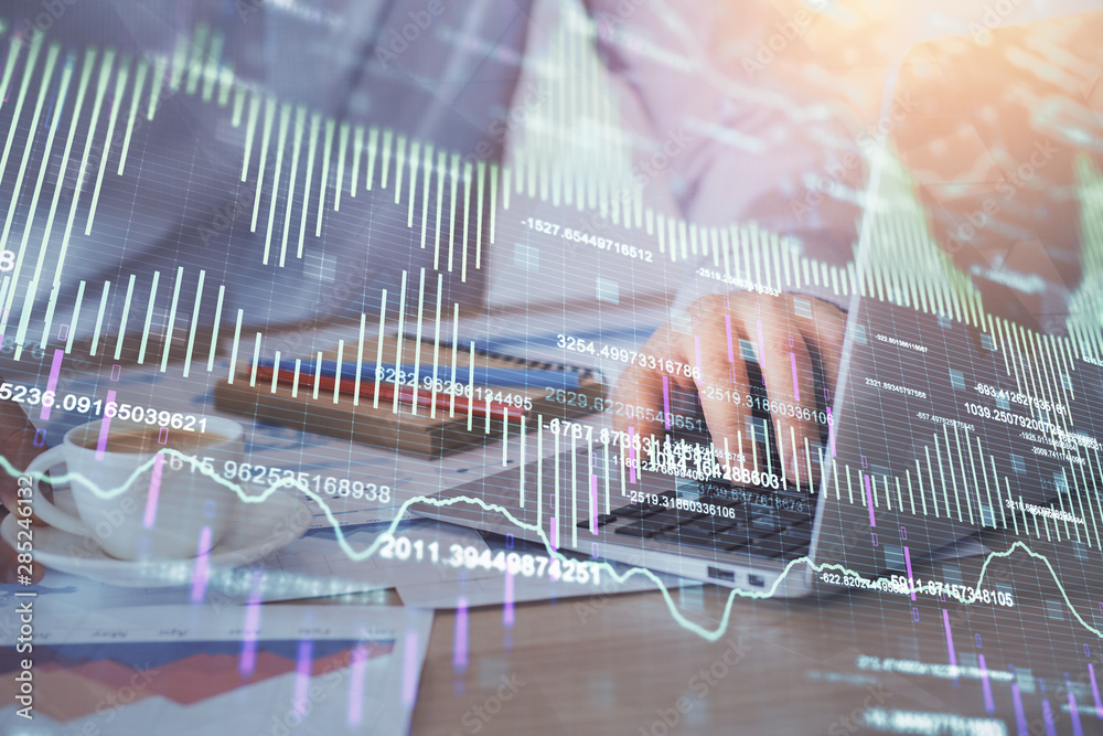 Poster forex graph with businessman working on computer in office on background. concept of hardworking. mu