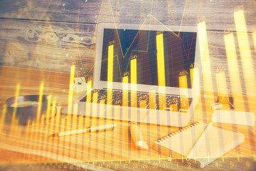 Multi exposure of chart and financial info and work space with computer background. Concept of international online trading.