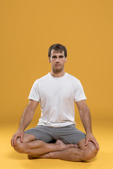 Man standing in lotus position