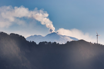 Eruption of a volcano seen from afar