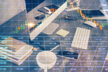 Double exposure of forex graph and work space with computer. Concept of international online trading.
