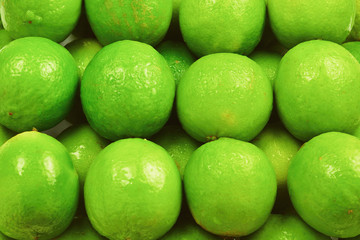 Many fresh limes on white background.