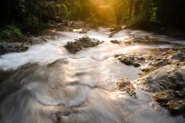 The early morning sunshine fell on the stream. Waterfall in Khlong LAN National Park Tourism...