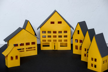 Paper City cut from a yellow paper on dark background