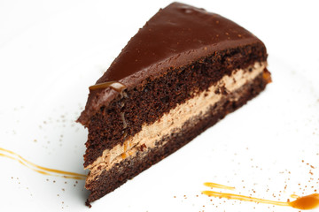 chocolate pie with honey on a white plate