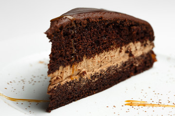 chocolate pie with honey on a white plate