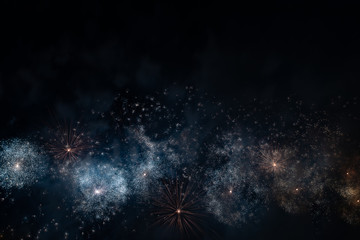 Colorful fireworks of various colors over night sky