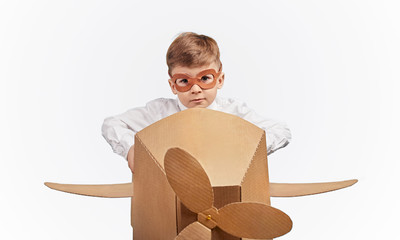 Kid with goggles pretending to be pilot