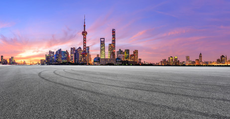Fototapeta na wymiar Shanghai skyline and modern buildings with empty race track at sunrise,panoramic view.