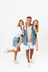 Obraz premium Full length photo of beautiful caucasian family woman and man with little girl smiling and posing together at camera