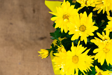 top view on a bouquet of yellow flowers with an orange center