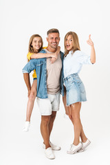 Full length photo of cheery caucasian family woman and man with little girl smiling and showing...