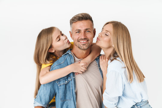 Photo of happy caucasian family woman and man with little girl smiling and posing together at camera