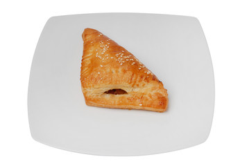 Tasty bun with jam on a white isolated background