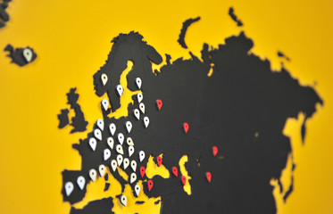 Fototapeta premium Map of Europe with pins on the yellow wall