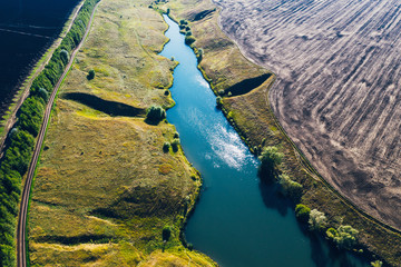 Aerial View Of Blue River From Above Among Summer Nature Landscape