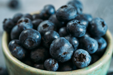 Fresh Blueberries in Plate. Raw Organic Bilberry Close Up for Healthy Eating