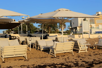an umbrella stands on the shores of the Mediterranean Sea in the north of Israel