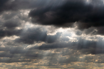 Obraz premium Dramatic sky panorama with sun rays between clouds. Idyllic sun beams cloudscape backdrop. Majestic cloud scenery