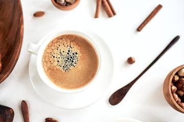 Breakfast with coffee and croissants on wooden table, top view
