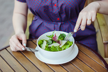 Woman eating healthy salad