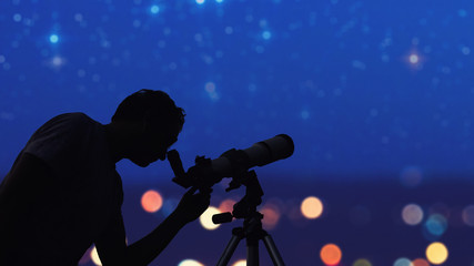 Astronomer with a telescope watching at the stars and Moon. My astronomy work.
