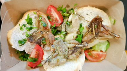 Cambodian dish grilled frog. Tasty exotic dishes are served in the restaurant. Street food frog legs