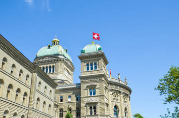 The Parliament Building in Bern, Switzerland. Seat of the Swiss Parliament. The Swiss federal government headquarters. The National Council and Council of States convene for regular sessions there - obrazy, fototapety, plakaty