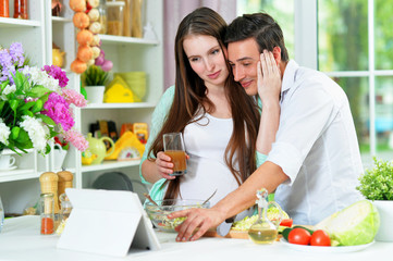 Portrait of happy husband and wife cooking together