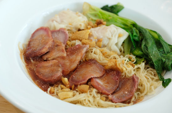 yellow nooddle with honey pork roasted and dumpling