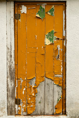 Old door with old yellow paint.