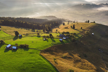 Fototapeta na wymiar Summer foggy sunrise in the Carpathian hills