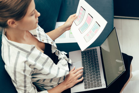 Young adult woman working on user interface at home office