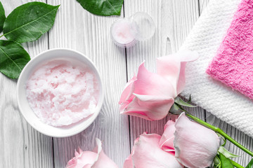 organic cosmetic with rose oil on wooden background top view