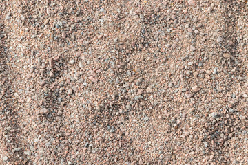 Small stones and sand of the playground