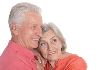 Smiling senior couple wearing bright clothing isolated