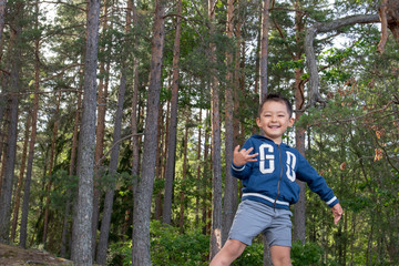 Boy in a beautiful and green landscape 