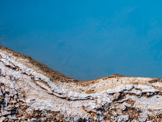 Blue geothermal pond at The Great Geysir, an active volcanic geyser in Southwestern Iceland