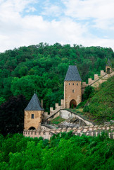 Fototapeta na wymiar Towers and protective wall of the Karlstejn castle in the Czech Republic