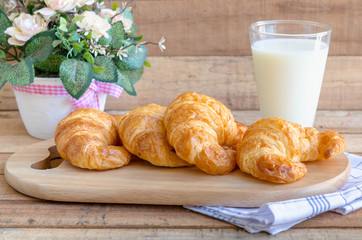 breakfast with milk and fresh butter croissants