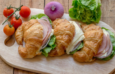 Close up of home made ham and cheese croissant sandwich.