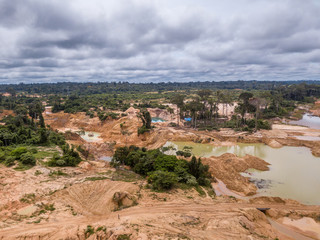 Fototapeta na wymiar Aerial view of deforested area of the Amazon rainforest caused by illegal mining activities in Brazil. Deforestation and illegal gold mining destroy the forest and contaminate the rivers with mercury.