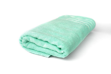 Green towel isolated on white background.
