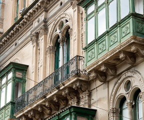 Fragment Of A Building With Windows And Balconies In Maltese Baroque Architecture Style