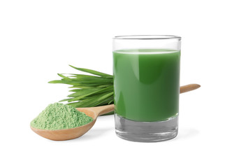 Glass of wheat grass juice, spoon with powder and sprouts on white background