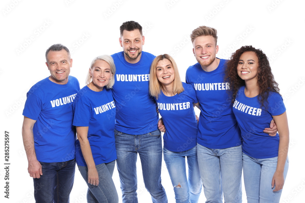 Wall mural Team of volunteers in uniform on white background