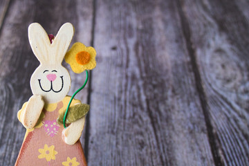 Easter bunny  souvenir in the wooden background
