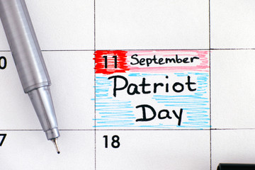 Reminder Patriot Day in calendar with black pen. September 11.